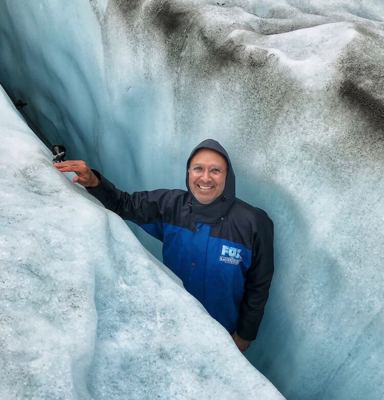 Steve, standing in a glacier crevice up to his neck