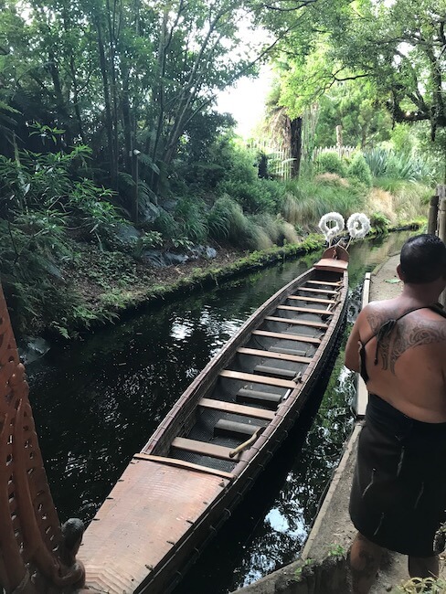 wooden canoe in a Maori village on a river