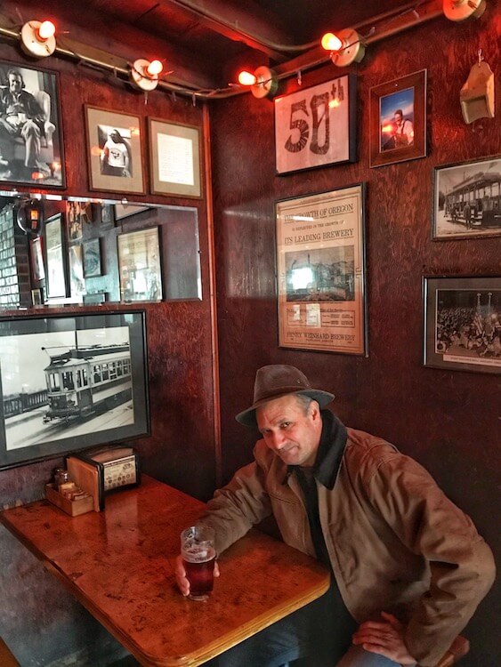Man having a beer in a cozy pub
