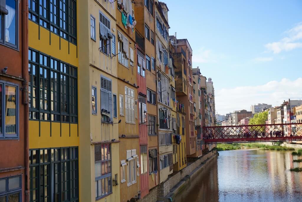 Colorful building and riverfront in Girona