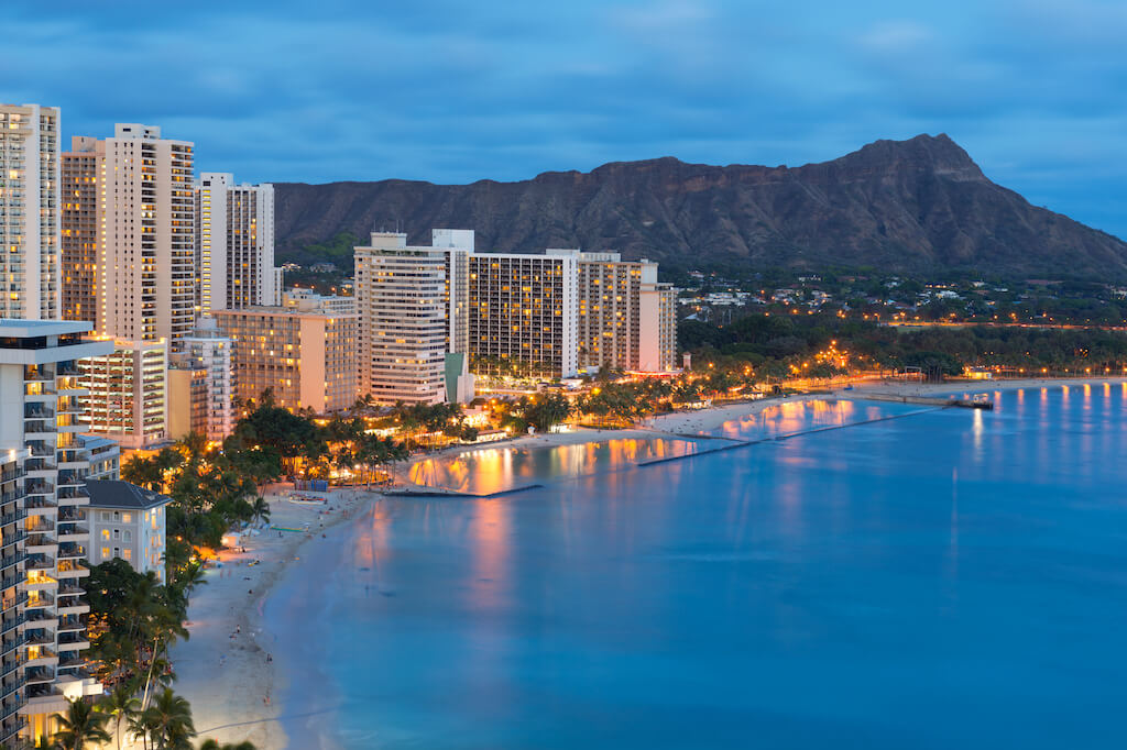 Scenic view of Honolulu city, Diamond Head and Waikiki Beach at night; Hawaii, USA