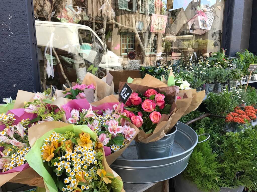 flowers outside a shop in France
