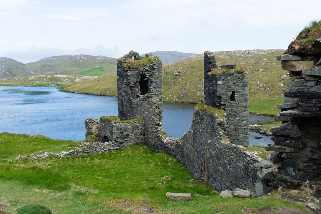 castle ruins above a lake