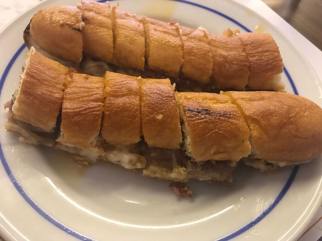 Portuguese hot dog on a plate from Gazela restaurant