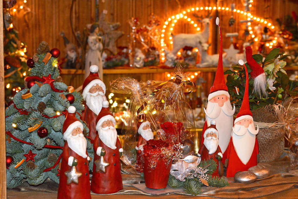 Santa statues and toys at a Christmas market
