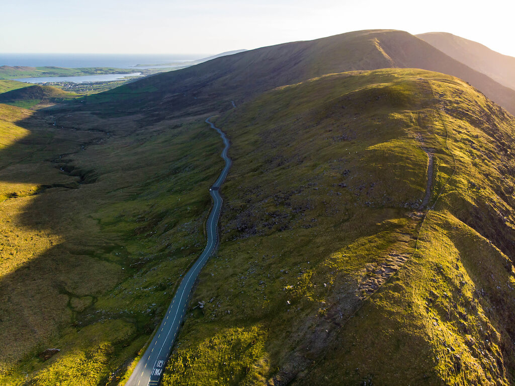 Aerial view of Conor Pass, one of the highest Irish mountain passes served by an asphalted road, located on the south-western end of the Dingle Peninsula, County Kerry, Ireland