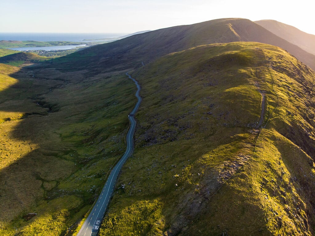 Aerial view of Conor Pass, one of the highest Irish mountain passes served by an asphalted road, located on the south-western end of the Dingle Peninsula, County Kerry, Ireland