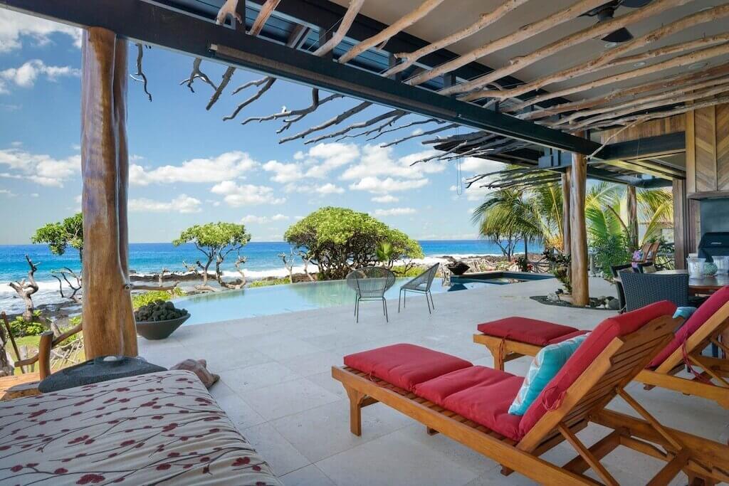 patio with pool and ocean view