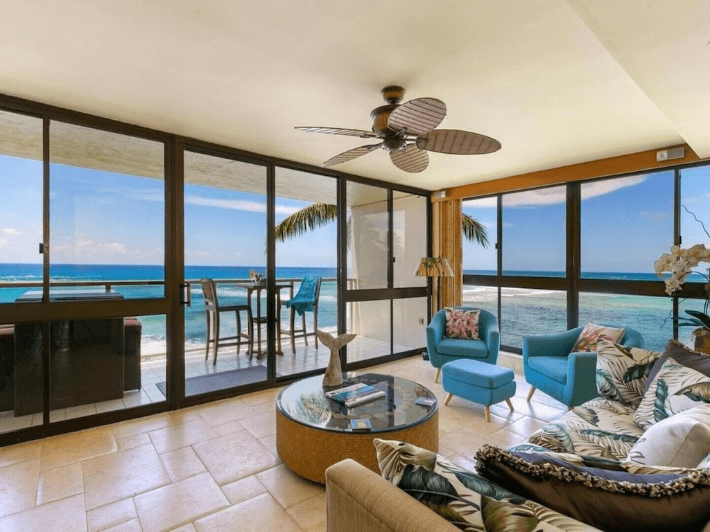 living room with ocean views and glass walls