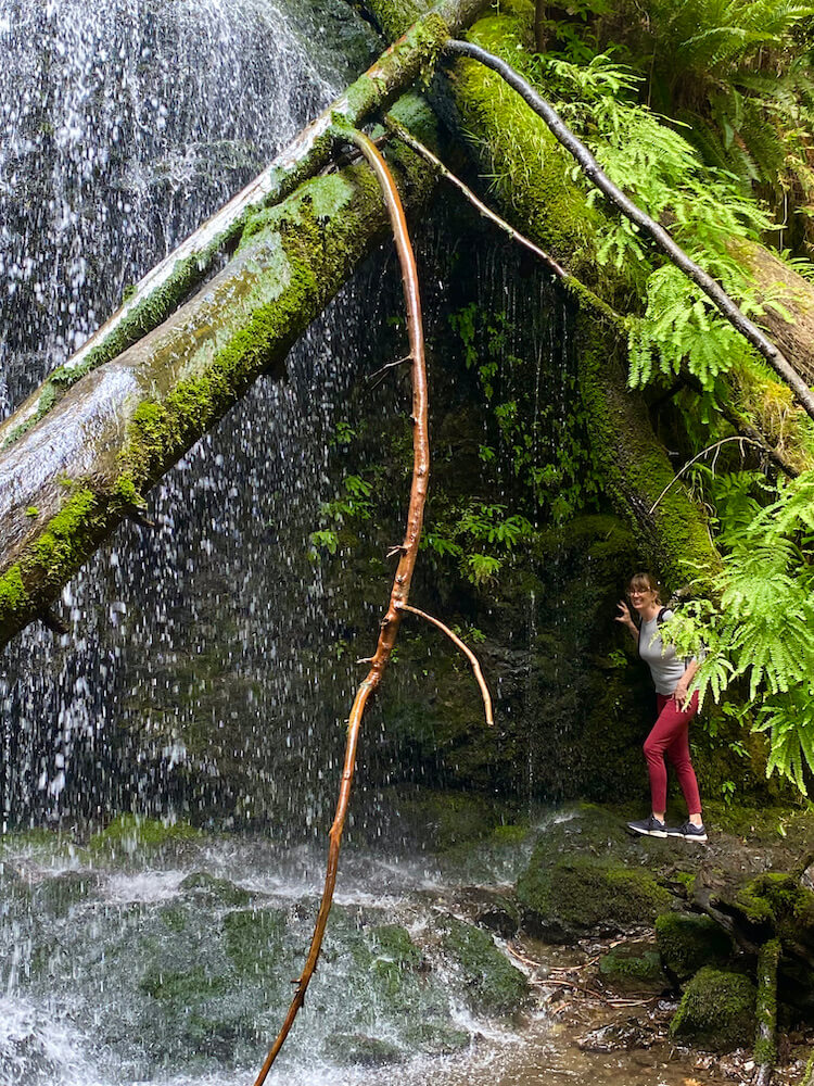 woman under waterfall