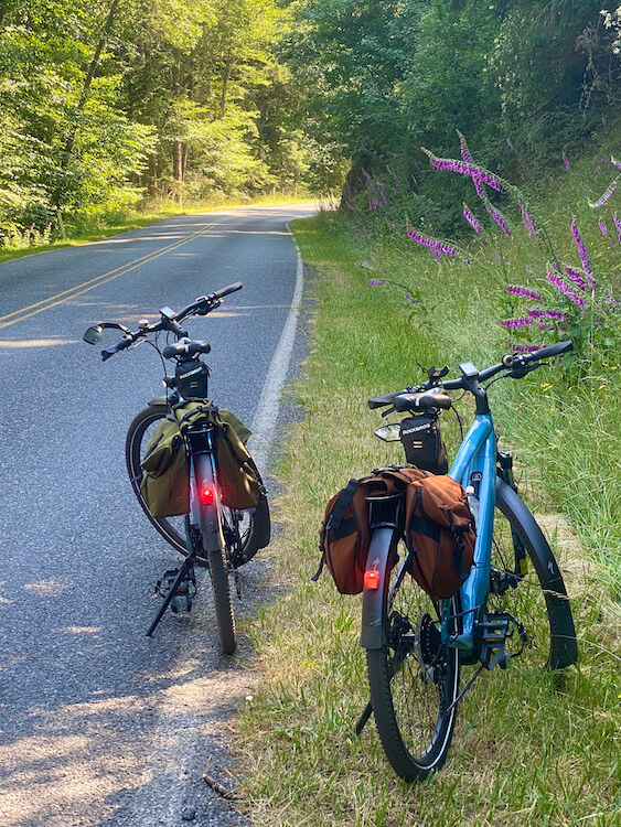 two electric bikes on a country road