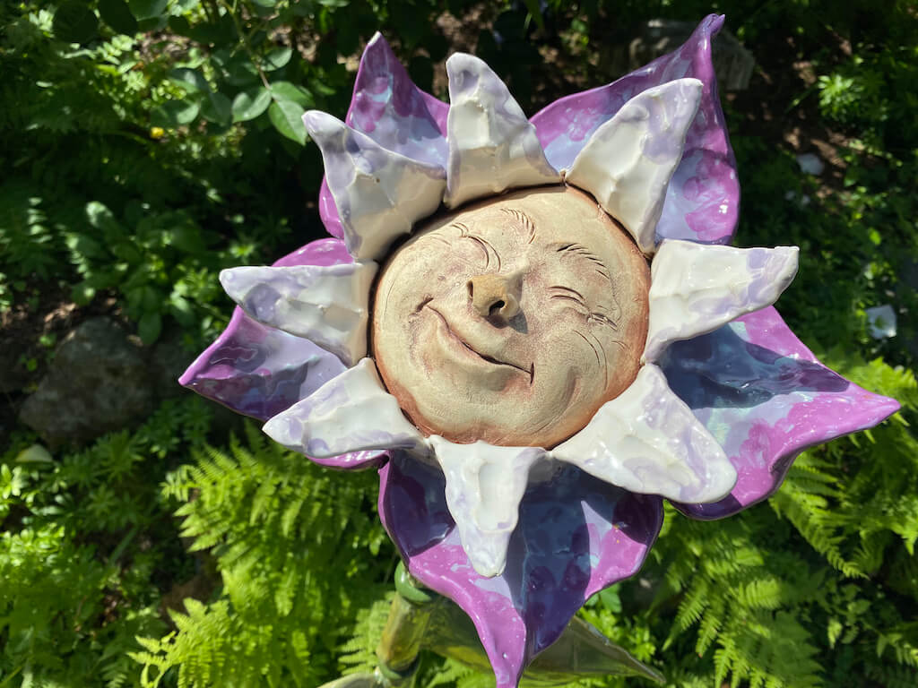 smiling face on a garden ornament