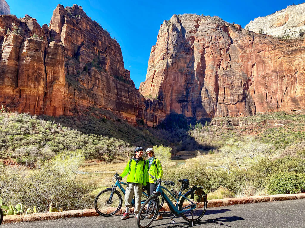 Two people in Zion valley on electric bikes