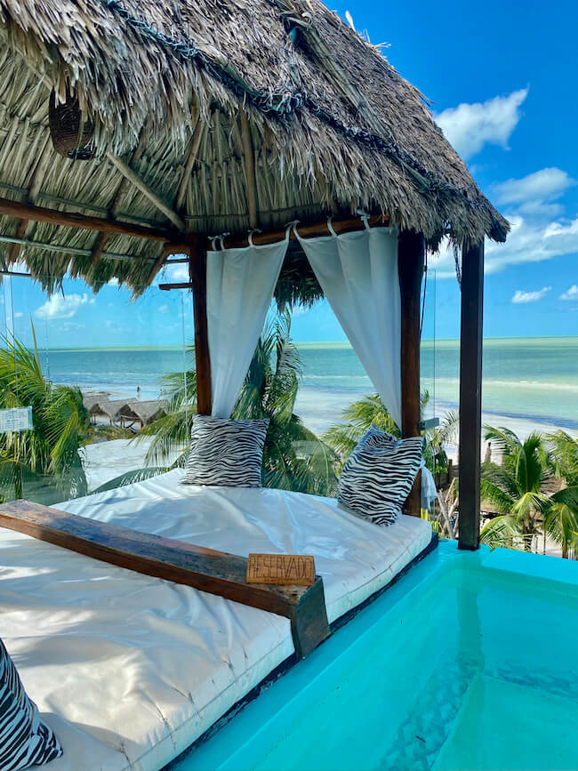 pool and rooftop bar with beach beyond at Alma Bar, one of the best things to do in Holbox