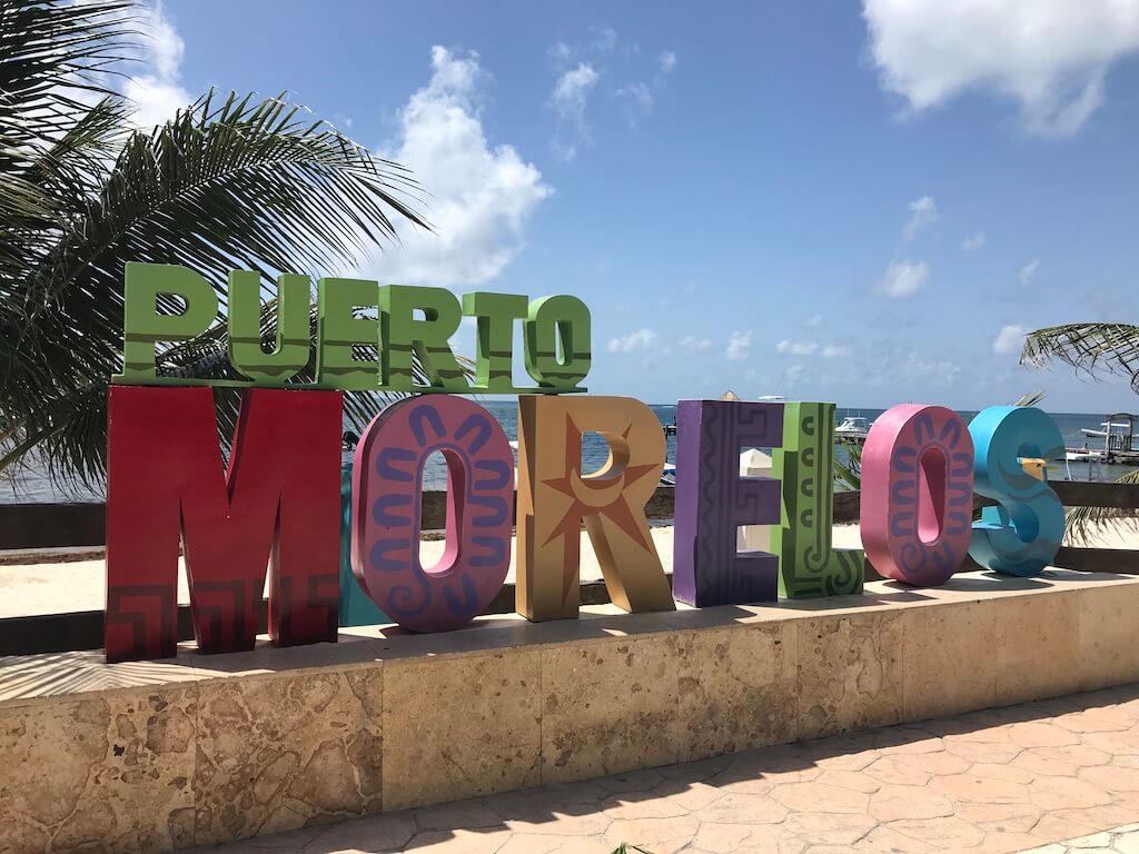 Colorful letters spelling out Puerto Morelos on the beach