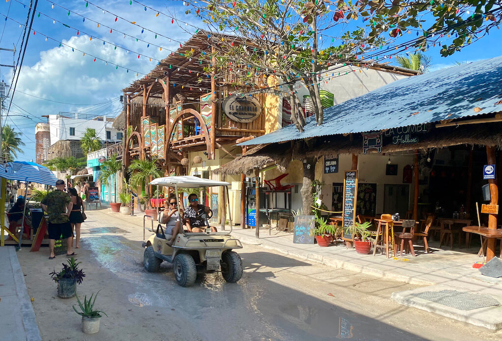 golf cart in downtown Holbox on a muddy street