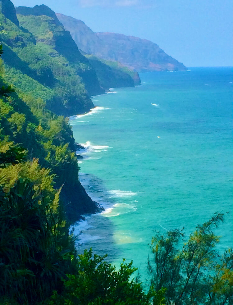 green Na Pali cliffs and turquoise ocean on Kalalau Trail
