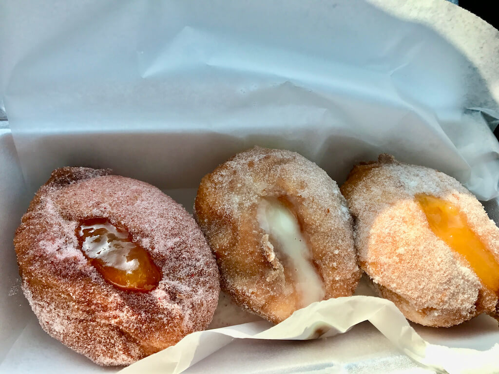 sugar coated malasadas (donuts) with fillings