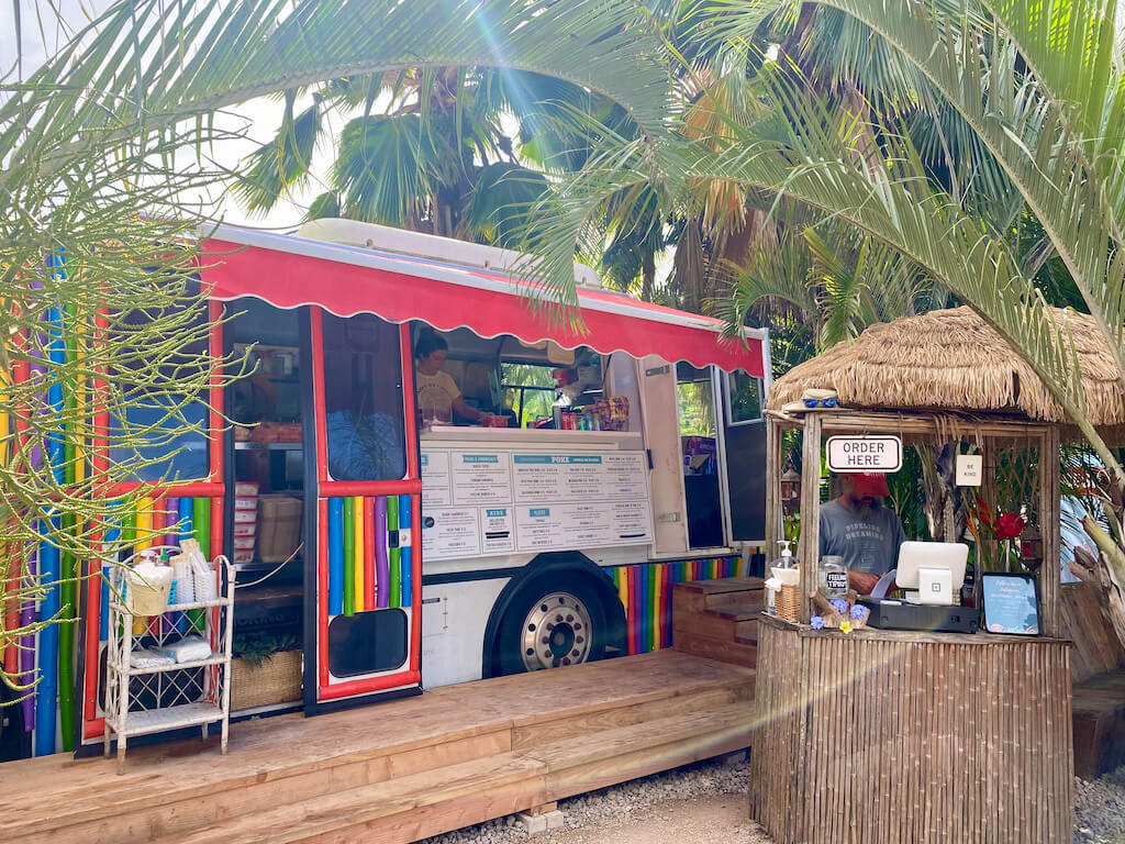rainbow food truck with tiki hut ordering window