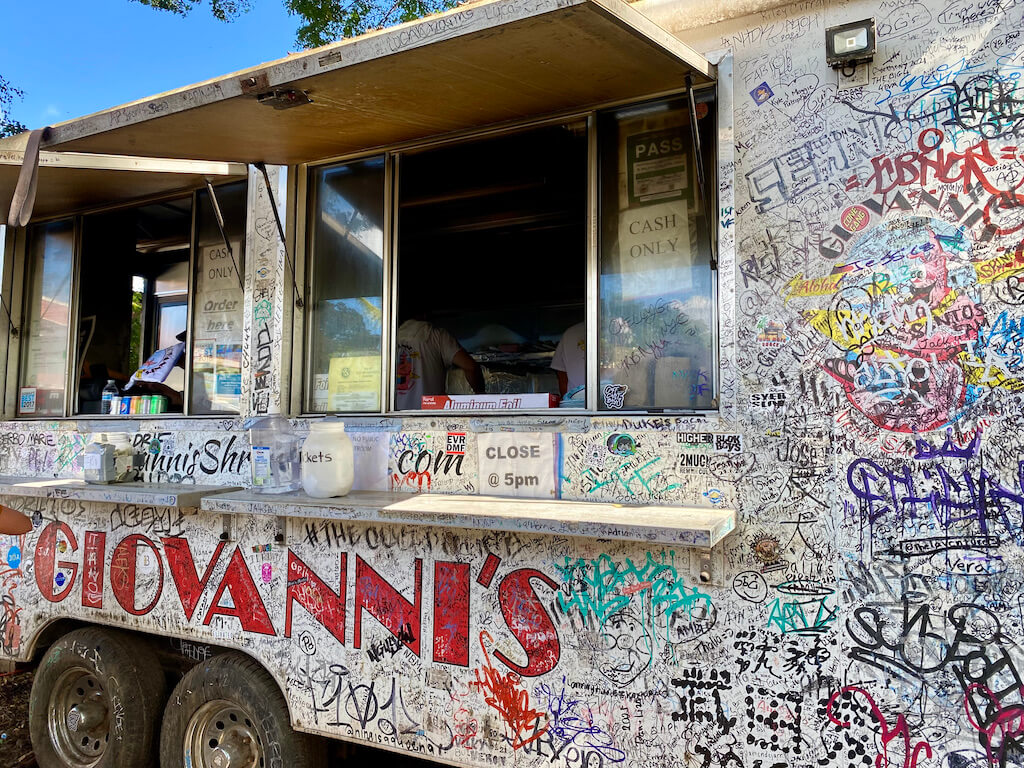 giovannis food truck covered in grafiti