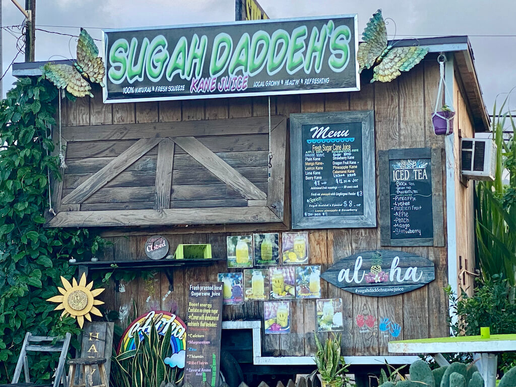 wooden food truck sign says "Sugah Daddehs"
