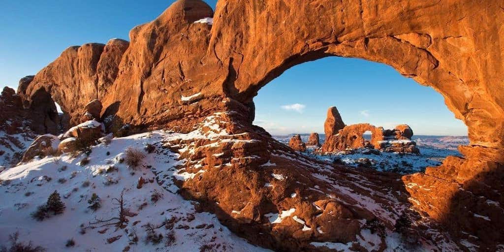 giant natural arch in snow