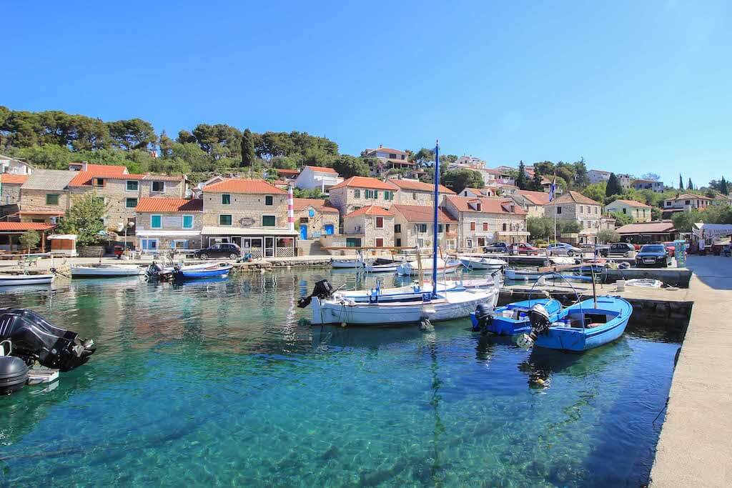 stone village and boats by the ocean on Solta