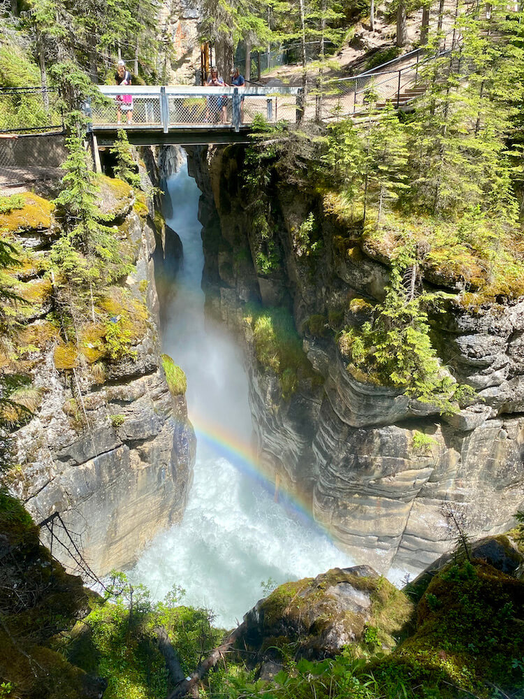 rainbow over the steep gorge at Maligne Canyon