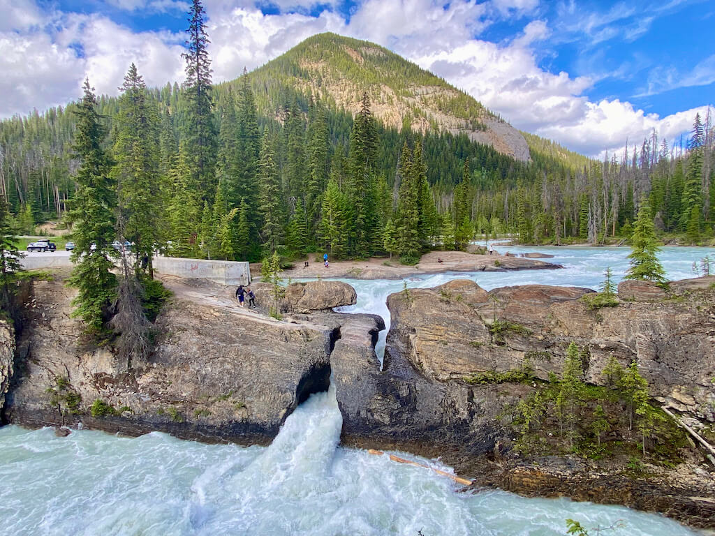 Natural Bridge and river with mountains in Yoho National Park