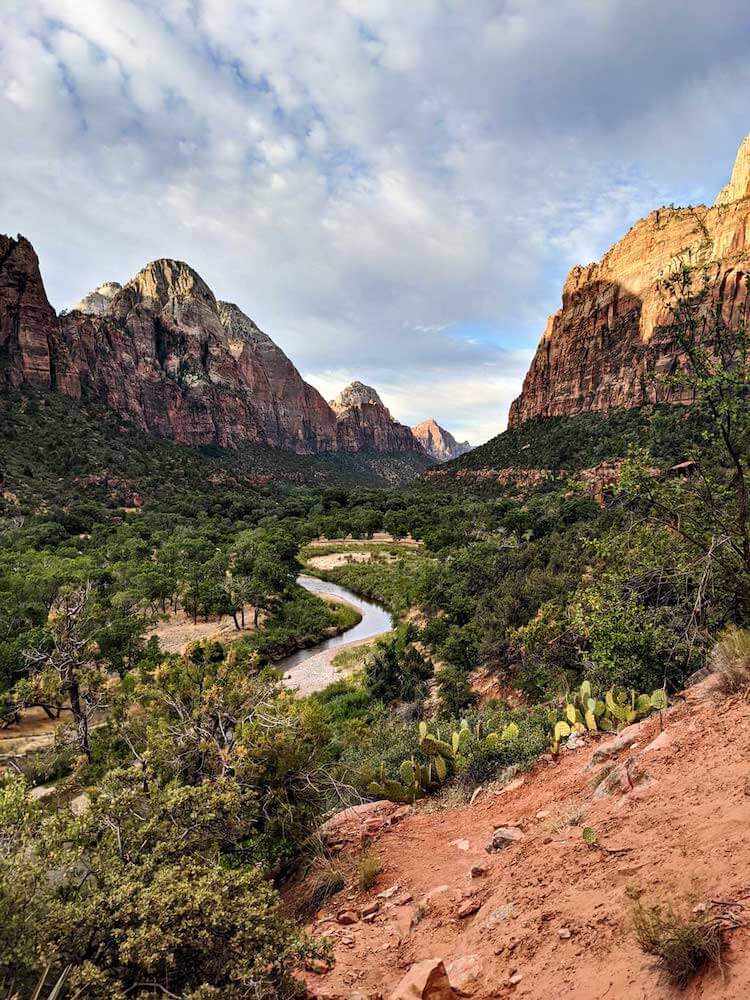 view of Virgin River winding through colorful mountains in Zion