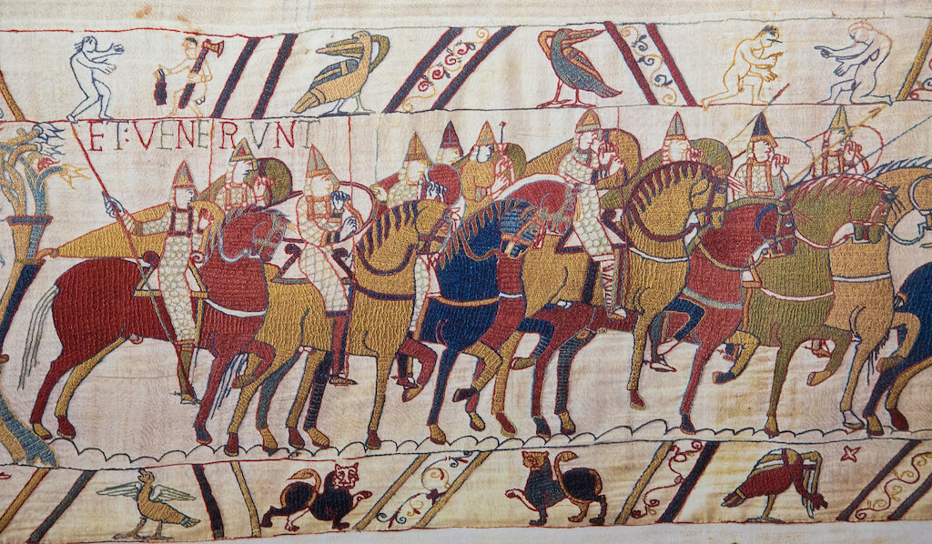 BAYEUX, FRANCE - FEB 12: Detail of the Bayeux Tapestry depicting the Norman invasion of England in the 11th Century on February 12, 2013. This tapestry is more than 900 years old, no property release is required.