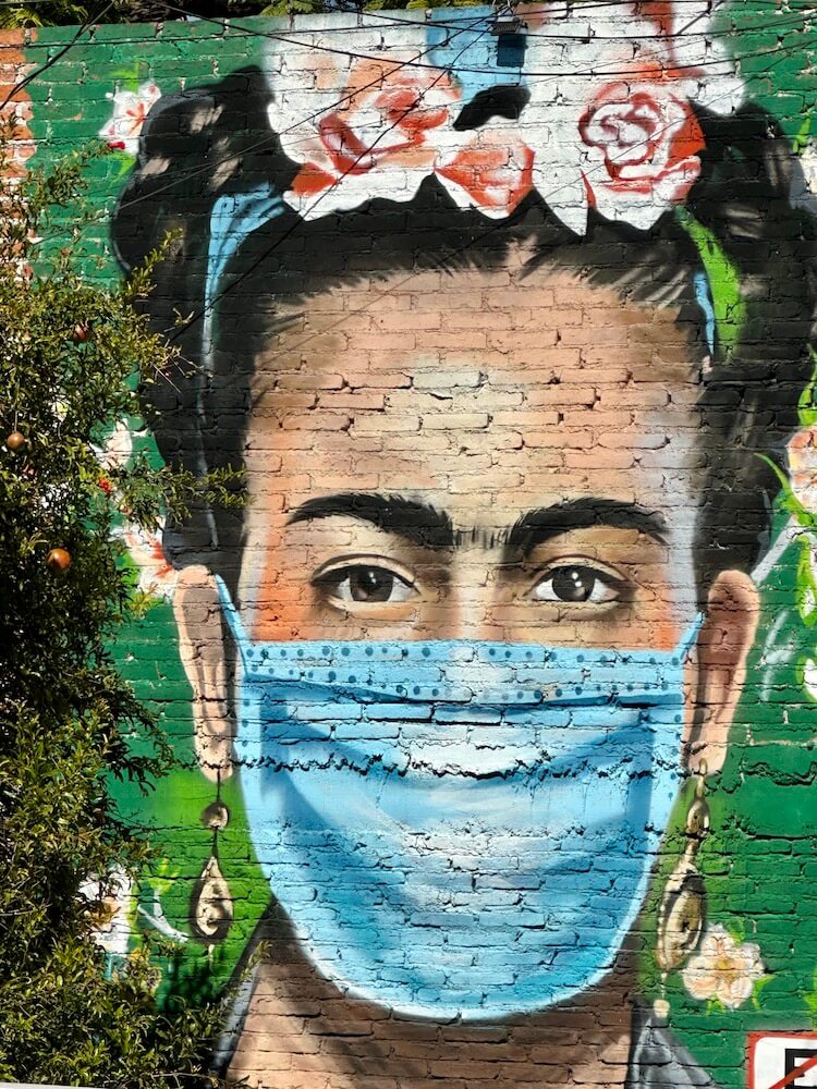 Mural of Frida Kahlo in a mask