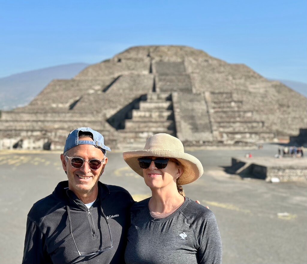 Man and woman in front of Teotihuacan pyramid