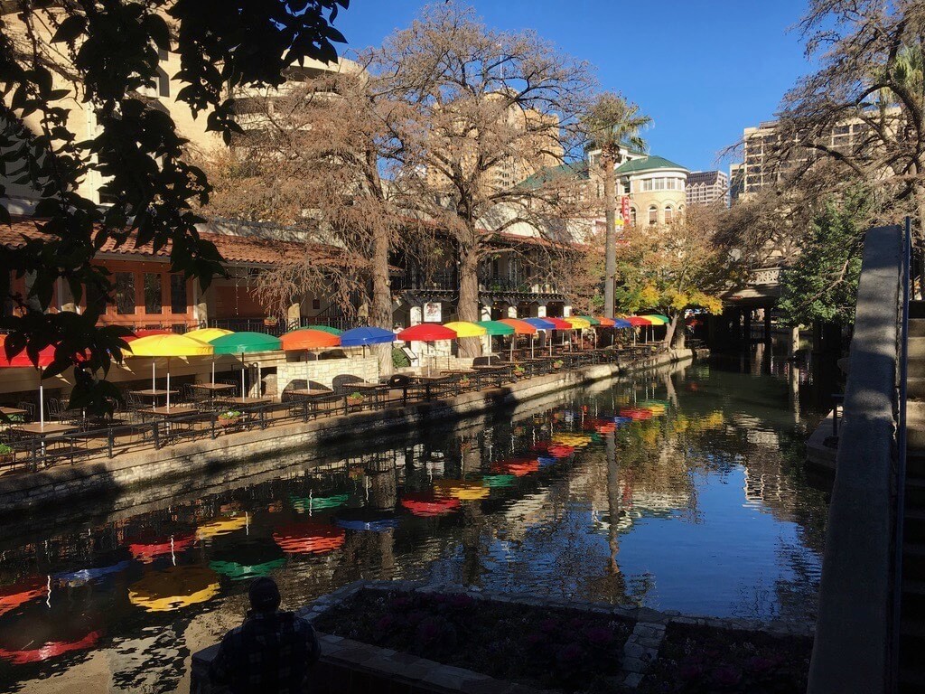 Riverwalk view of colored sun umbrellas, San Antonio, Texas