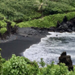 black sand beach on road to hana on Maui island