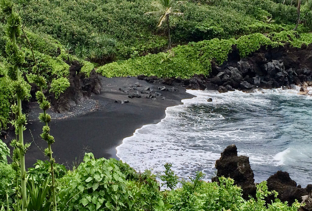 black sand beach on road to hana on Maui island