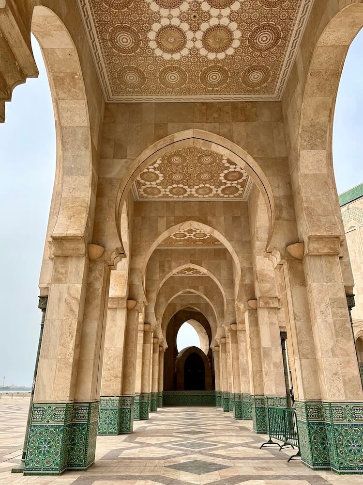 View through arches in the exterior of Hassan II mosque