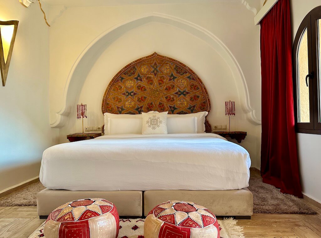 bed in a colorful riad in Chefchouan