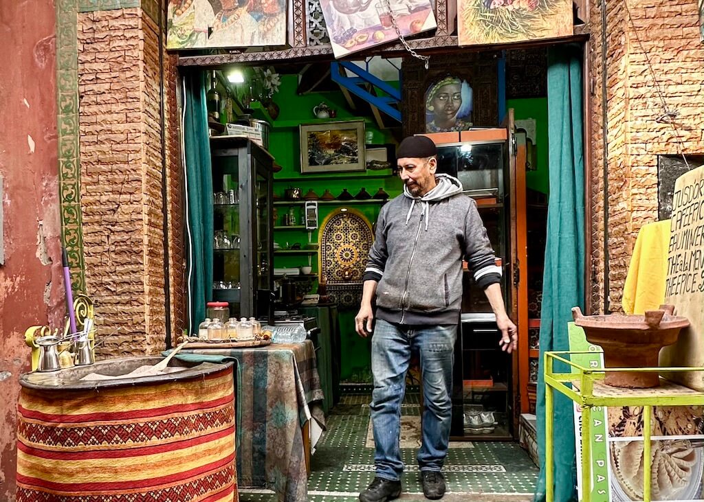 man selling turkish coffee in the Marrakesh medina