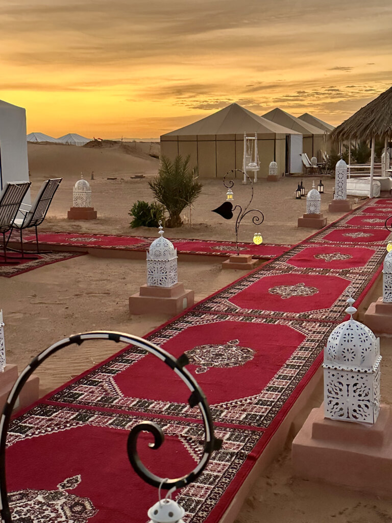 Sunrise over luxury desert camp in Sahara Desert