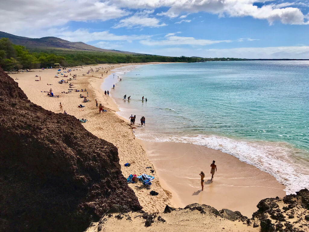 sandy beach and ocean with bathers at Makena Beah Maui
