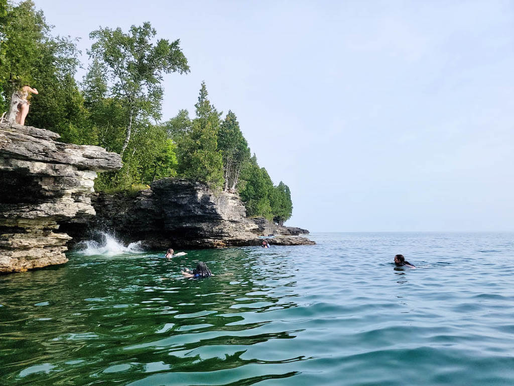 people swimming in the lake at Door County, Wisconsin in August