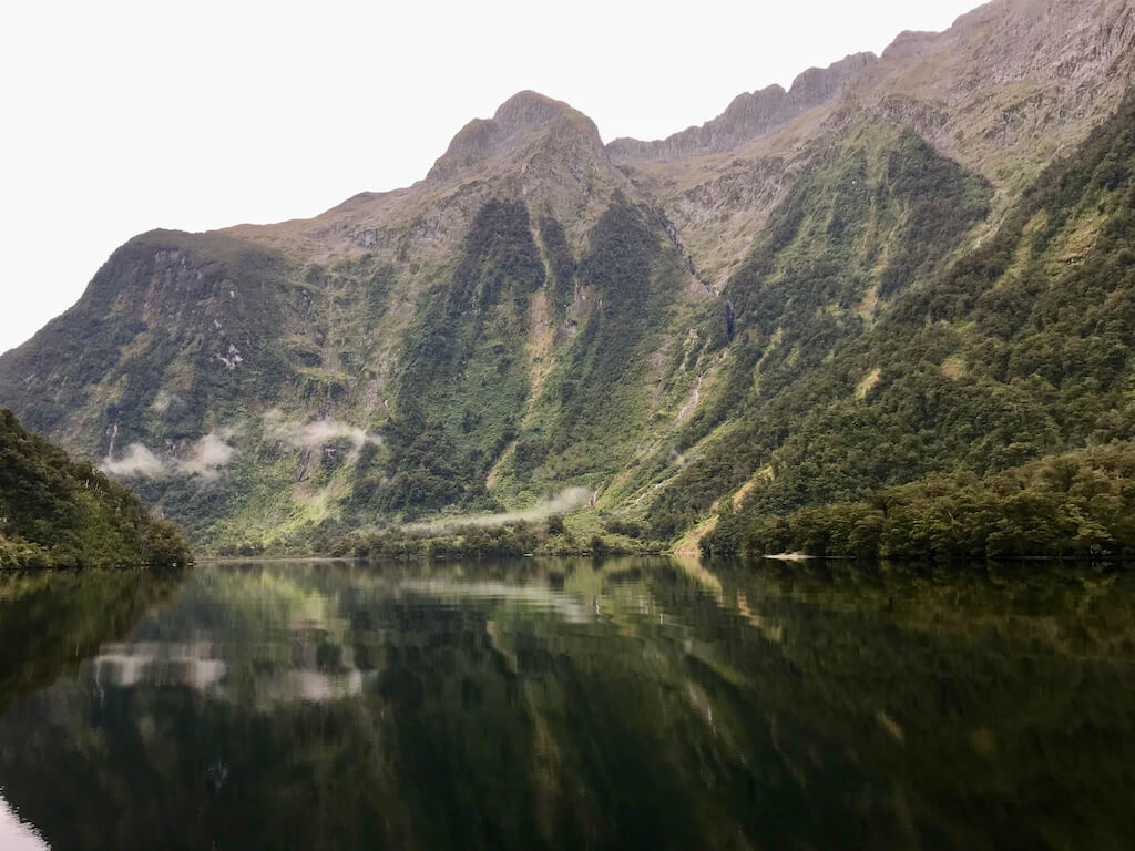 clouds and green cliffs over Doubtful Sound