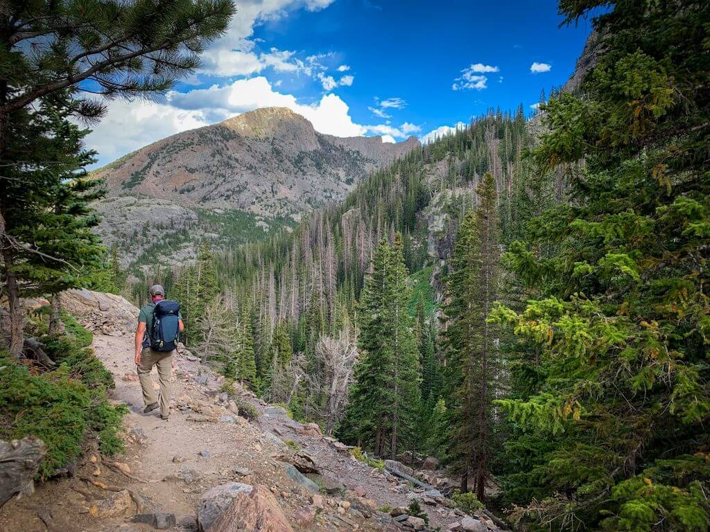 Man hiking in Rocky Mountain National Park, CO