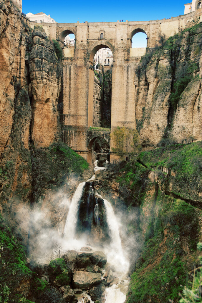 waterfall spewing through a deep gorge in Ronda