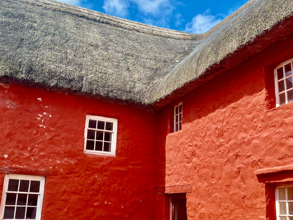 red building with straw roof at St Fagans Natural History Museum in Cardiff