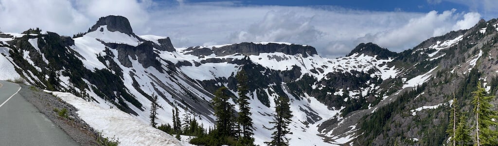 Pano of snow covered peaks at Mt Baker Summit while driving the Mt Baker Scenic Highway