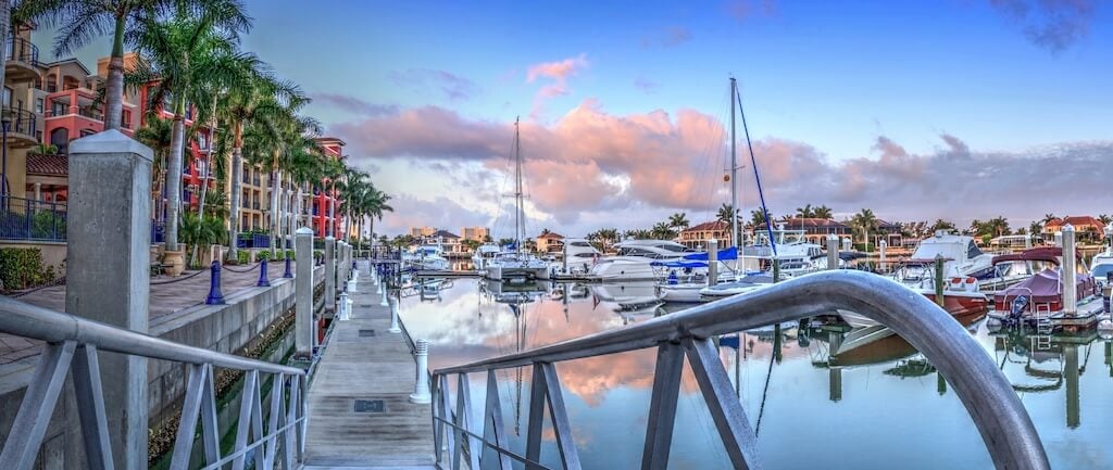 Sunrise over the boats in Esplanade Harbor Marina in Marco Island, Florida